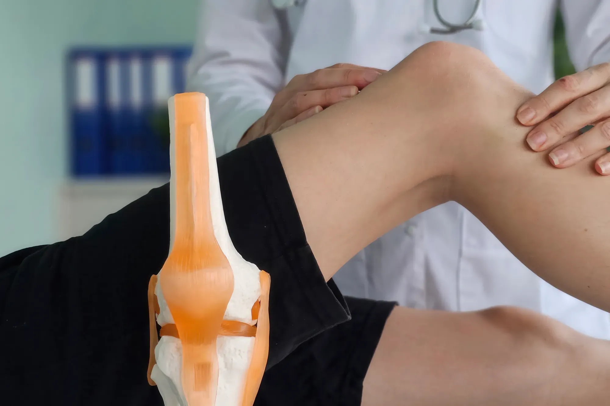 Specialist assessing sports injury.